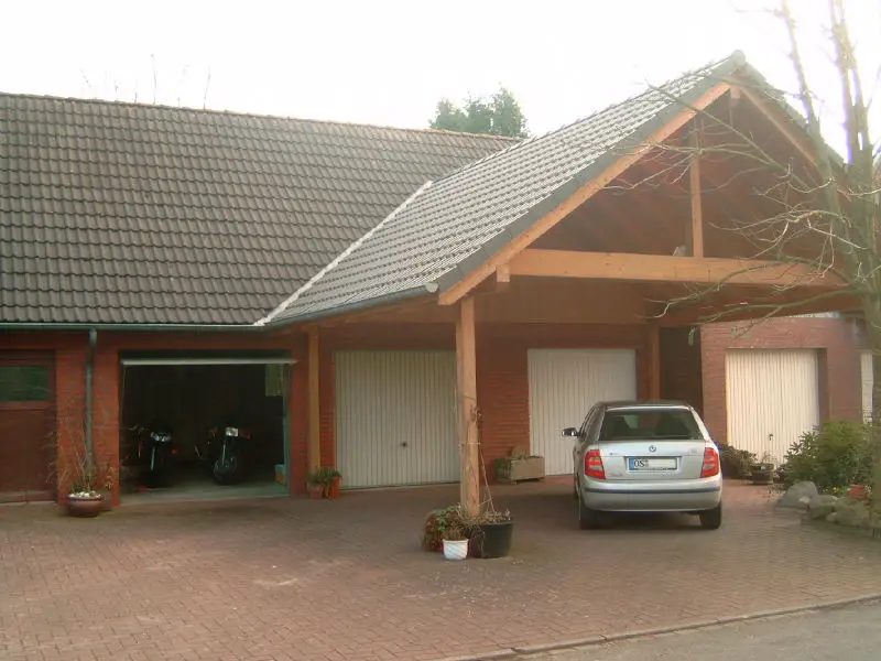 carport in front of a garage